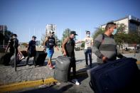 Migrants seeking for a U.S. work visa are pictured as they boarding a bus that will take to their hotel in Monterrey