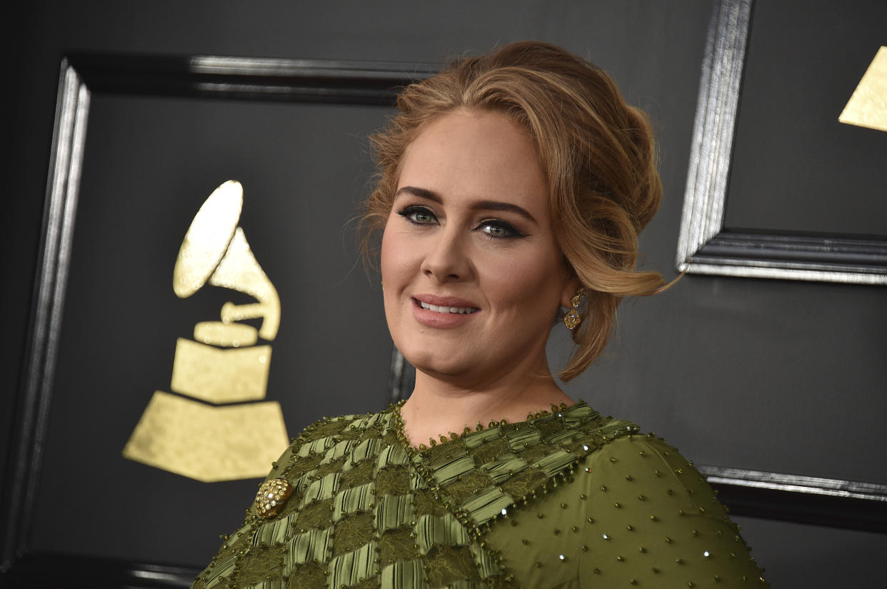 FILE - In this Feb. 12, 2017, file photo, Adele arrives at the 59th annual Grammy Awards at the Staples Center in Los Angeles. Adele saluted Emma Stone and "Moonlight's" Oscar wins by giving thumbs up in an Instagram photo on Feb. 27, 2017. (Photo by Jordan Strauss/Invision/AP, File)