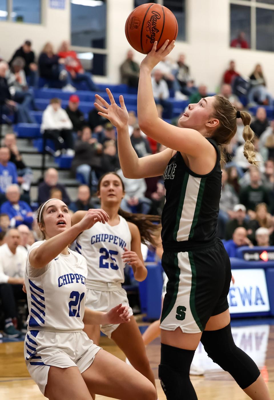 Smithville's Naomi Keib gets this bucket in the first half with Chippewa's Annabel Rodriguez watching on.