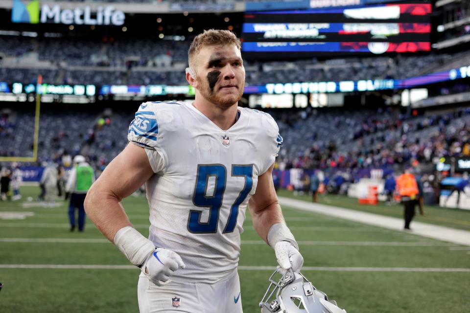 Detroit Lions defensive end Aidan Hutchinson runs off the field after a win against the New York Giants on Sunday, Nov. 20, 2022, in East Rutherford, N.J.