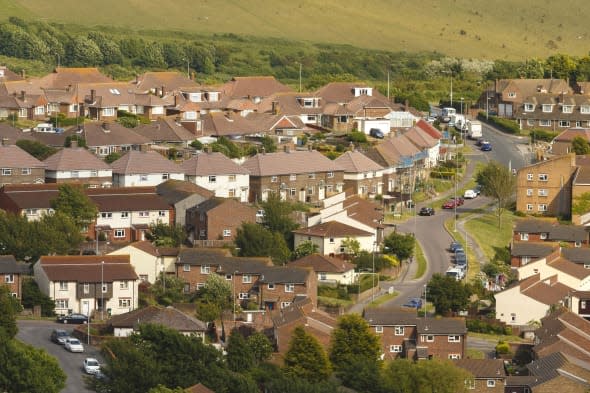 File photo dated 25/06/13 of an aerial view of houses in Brighton as nearly one million people are estimated to have taken out a payday loan in the last year to help cover their rent or mortgage costs, according to research from Shelter. PRESS ASSOCIATION Photo. Issue date: Wednesday January 15, 2014. The housing charity said that one in 50 (2%) people it surveyed said they had done this, which would equate to nearly 885,000 adults if the findings were projected across Britain. Shelter said it dealt with just under 9,000 calls to its helpline from people struggling to pay their rent or mortgage last year, rocketing by one third (32%) on the total for 2012. Its findings about the extent to which people are using loans to plug gaps in their finances came from a survey of almost 3,700 people in November who pay rent or a mortgage. See PA story MONEY Borrow. Photo credit should read: Chris Ison/PA Wire