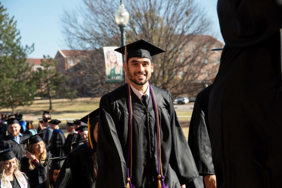 A graduate participates in The Walk just before the Winter Commencement at OBU this week.