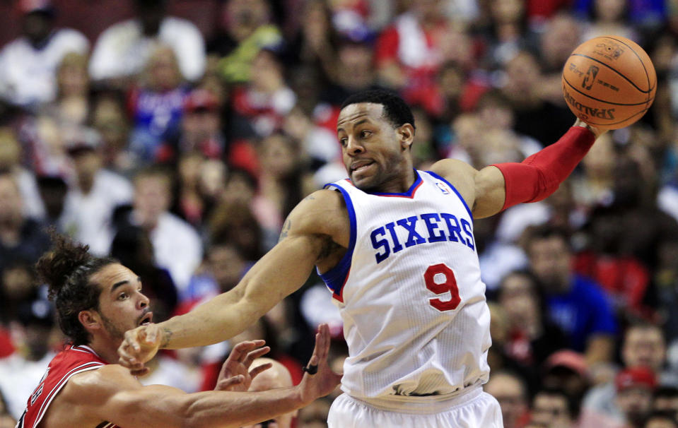 Philadelphia 76ers' Andre Iguodala (9) holds the ball away from Chicago Bulls' Joakim Noah (13) during the first quarter of Game 3 in an NBA basketball first-round playoff series in Philadelphia, Friday, May 4, 2012. (AP Photo/Mel Evans)