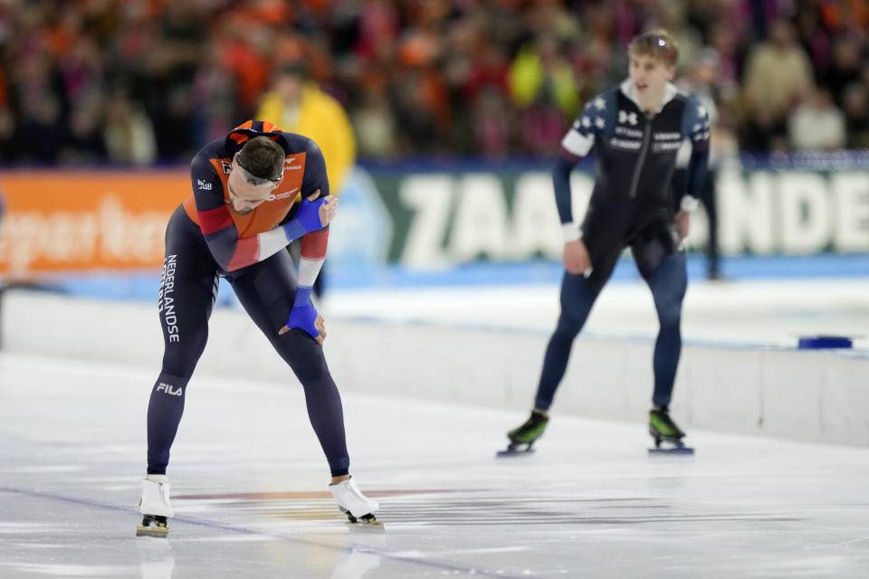 Kjeld Nuis of the Netherlands, left, shows his disappointment with a second place after losing to Jordan Stolz of the U.S., right and gold medal, during the 1500m Men event of the Speedskating Single Distance World Championships at Thialf ice arena Heerenveen, Netherlands, Sunday, March 5, 2023. (AP Photo/Peter Dejong)