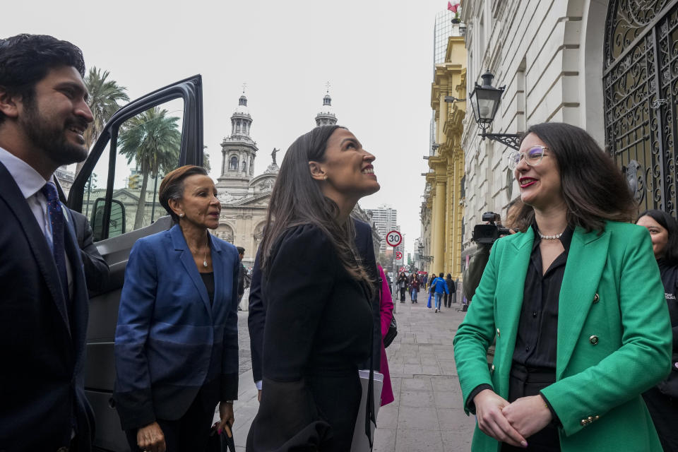 Congressman Greg Casar, (D-TX), from left, Congresswoman Nydia Velazquez, D-NY, Congresswoman Alexandria Ocasio-Cortez, (D-NY), are received by Mayor Iraci Hassler, upon their arrival to City Hall in Santiago, Chile, Thursday, Aug. 17, 2023. The three representatives are part of a US delegation who traveled to the South American country to learn about efforts to defend its democracy ahead of the 50th anniversary of the military coup led by Gen. Augusto Pinochet. (AP Photo/Esteban Felix)