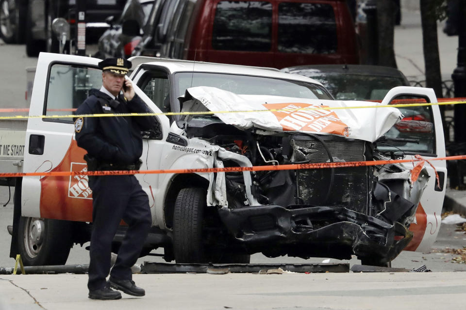 FILE — A damaged Home Depot truck remains on the scene, Nov. 1, 2017, after the driver mowed down people on a riverfront bike path near the World Trade Center on Tuesday, in New York. A federal judge barred the general public and media from a courtroom Tuesday, Feb. 21, 2023, where defense lawyers claim emotional testimony from victims has spoiled the death penalty phase of the trial of Sayfullo Saipov who admits that he killed eight people on a bike path on behalf of a terrorist group. (AP Photo/Mark Lennihan, File)