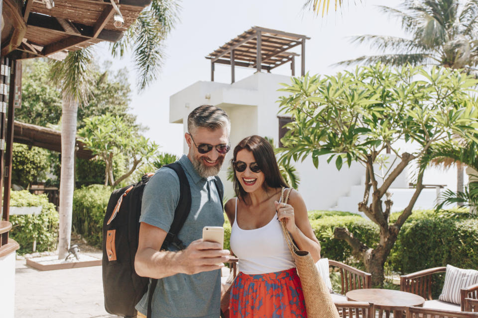 A happy couple in the courtyard of a tropical time-share resort.