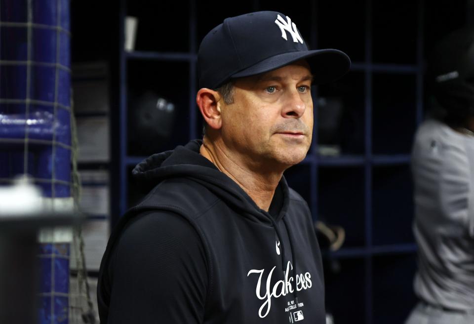 Jul 9, 2024; St. Petersburg, Florida, USA; New York Yankees manager Aaron Boone (17) looks on against the Tampa Bay Rays during the seventh inning at Tropicana Field. Mandatory Credit: Kim Klement Neitzel-USA TODAY Sports