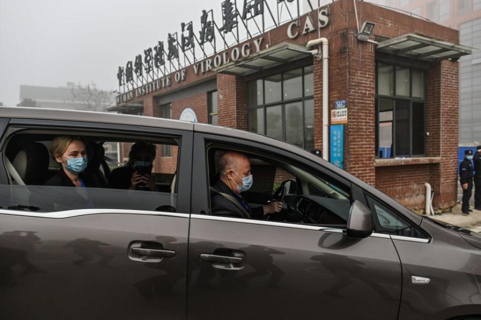 Members of the World Health Organization team investigating the origins of the COVID-19 coronavirus arrive at the Wuhan Institute of Virology on Feb. 3, 2021.