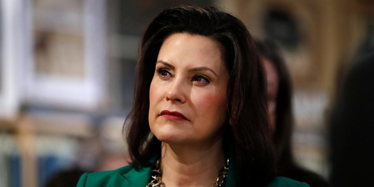 FILE - In this March 18, 2019, file photo, Michigan Gov. Gretchen Whitmer listens to Democratic presidential candidate Sen. Kirsten Gillibrand, D-N.Y., in Clawson, Mich. Whitmer is moving to make Michigan the first state to ban flavored e-cigarettes. The Democrat announced Wednesday, Sept. 4 that she ordered the state health department to issue emergency rules. They will prohibit the sale and misleading marketing of flavored nicotine vaping products.  (AP Photo/Paul Sancya, File)