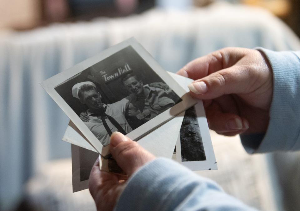 Jana Nicol, of Lansing, talks about her late father Duane Nicol's photo albums and scrapbooks, Tuesday, Dec. 5, 2023. Duane was a World War II Navy veteran, serving in both the Pacific and Atlantic theaters. Jana, now 60, has spent the past two years transcribing her father's journal, photo albums, and more than 300 letters sent home during his tours of duty abroad.