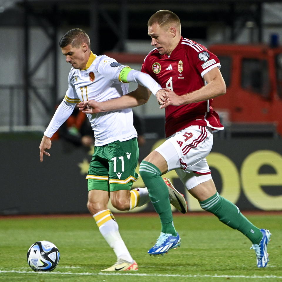 Hungary's Attila Szalai, right, and Bulgaria's Kiril Despodov, left, challenge for the ball during the Euro 2024 group G qualifying soccer match between Bulgaria and Hungary at the Vasil Levski National Stadium in Sofia, Bulgaria, Thursday, Nov. 16, 2023. (Zsolt Szigetvary/MTI via AP)