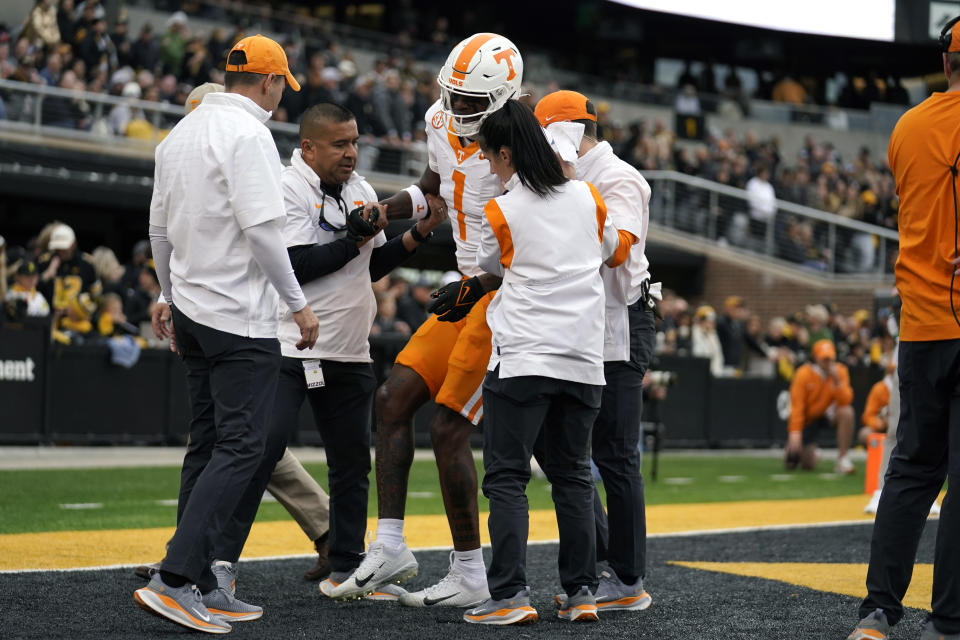 Tennessee wide receiver Dont'e Thornton Jr. is helped off the field after being injured while catching a touchdown pass during the first half of an NCAA college football game against Missouri Saturday, Nov. 11, 2023, in Columbia, Mo. (AP Photo/Jeff Roberson)