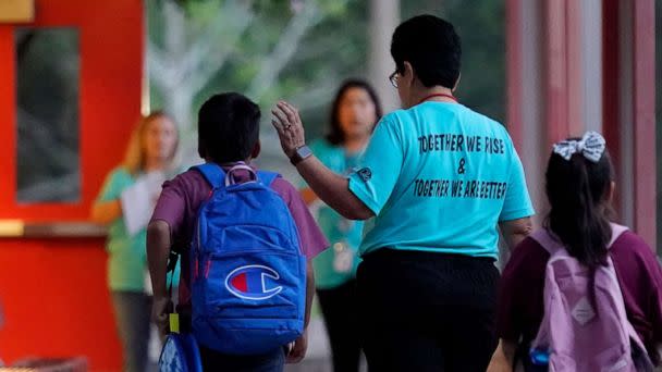 PHOTO: Students arrive at Uvalde Elementary, now protected by a fence and Texas State Troopers, for the first day of school, on Sept. 6, 2022, in Uvalde, Texas. (Eric Gay/AP)