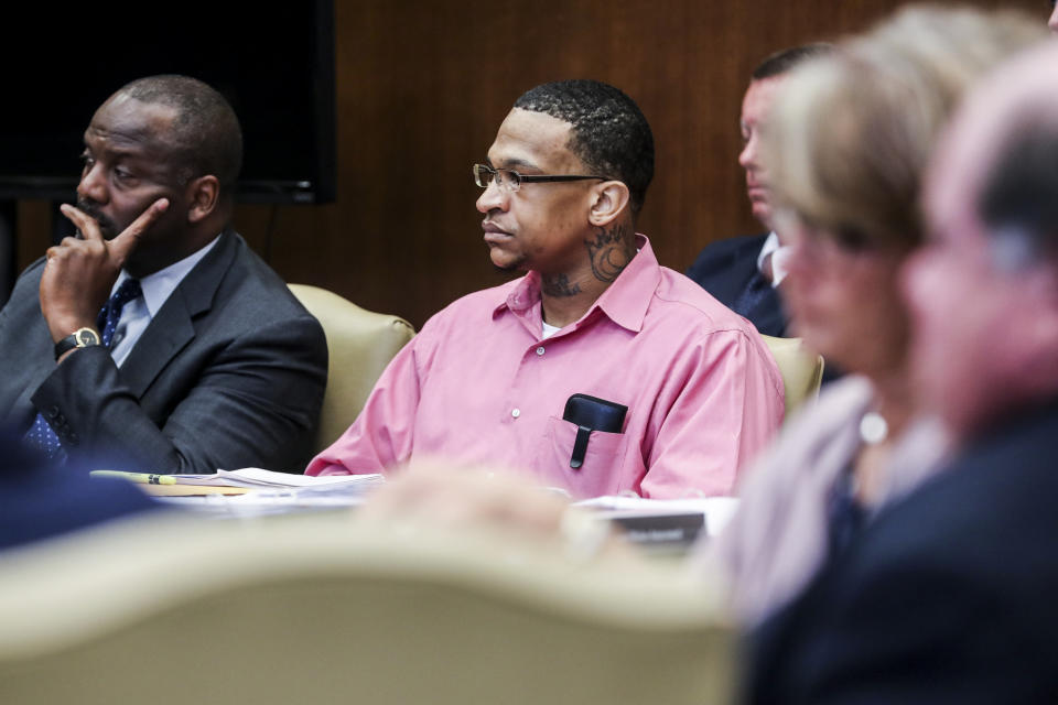 Quinton Tellis, right, is seen on the first day of his retrial in Batesville, Miss., Tuesday, Sept. 25 2018. Tellis is charged with burning 19-year-old Jessica Chambers to death almost three years ago on Dec. 6, 2014. Tellis has pleaded not guilty to the murder. (Brad Vest/The Commercial Appeal via AP, Pool)