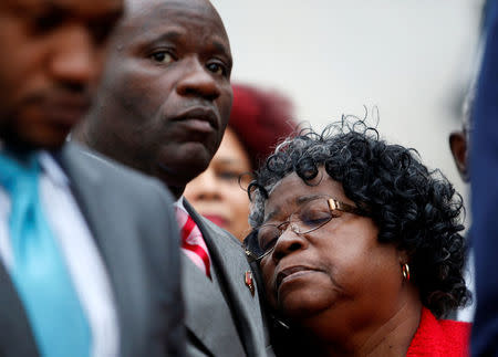 Judy Scott (R) is held by her son Rodney after a hung jury was announced in the trial of former North Charleston police officer Michael Slager outside the Charleston County Courthouse in Charleston, South Carolina December 5, 2016. REUTERS/Randall Hill