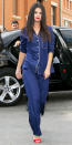 <p>Gomez kicked off her reign as the PJ queen in a pair of navy sleepwear (shop a similar look <a rel="nofollow noopener" href="https://www.bloomingdales.com/shop/product/eberjey-gisele-pj-set?" target="_blank" data-ylk="slk:here;elm:context_link;itc:0;sec:content-canvas" class="link ">here</a>), which she complemented with a bold red lip and matching sandals. </p>