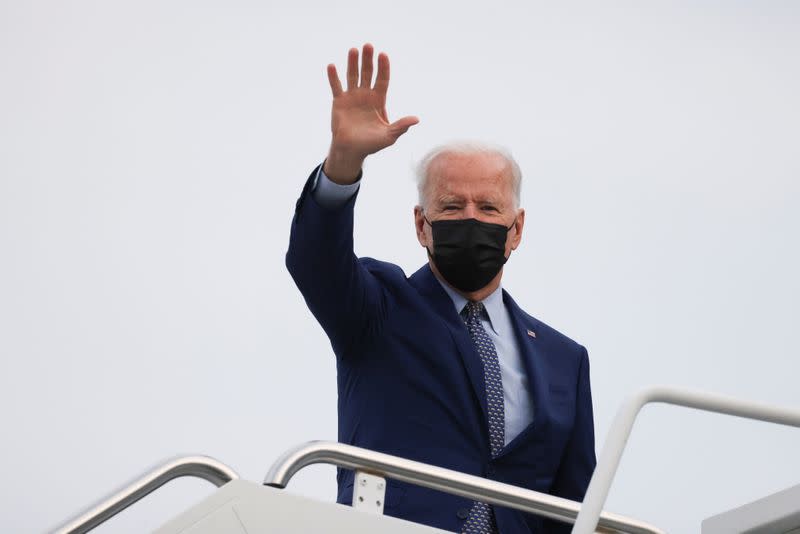 FILE PHOTO: U.S. President Joe Biden waves as he boards Air Force One after attending the Democratic National Committee's "Back on Track" drive-in car rally, in Georgia