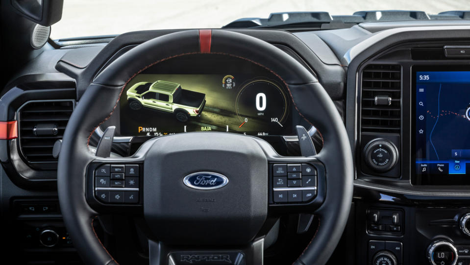 The steering wheel and dash inside the 2023 Ford F-150 Raptor R.