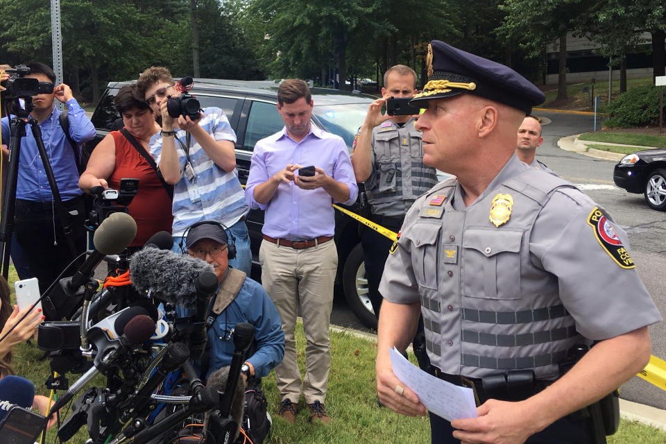 Fairfax County Police Chief Edwin Roessler briefs reporters on reports of a man with a gun entering the McLean office building that is home to USA Today headquarters, Wednesday, Aug. 7, 2019 in McLean, Va. Roessler says it’s not clear yet whether that report is true. He says so far there are no reports of gunshots being fired. (AP Photo/Matthew Barakat)