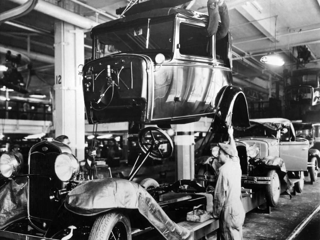 Assembly line production of the Model A at a Ford automobile plant in Detroit, Michigan, 1927.