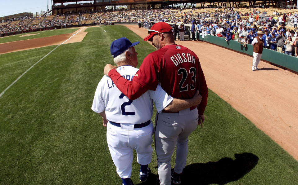 Hall of Fame and former Los Angeles Dodgers manager Tommy Lasorda passed away at the age of 93. Los Angeles Dodgers manager Tommy Lasorda and former Dodger great and current Arizona Diamondbacks bench coach Kirk Gibson (23) share a moment before a game at the Ballpark at Camelback Ranch on Wednesday, March 10, 2010, in Glendale, Arizona. Lasorda and Gibson will forever be linked to the 1988 game one World Series game winning home run. (Keith Birmingham/The Orange County Register via AP)