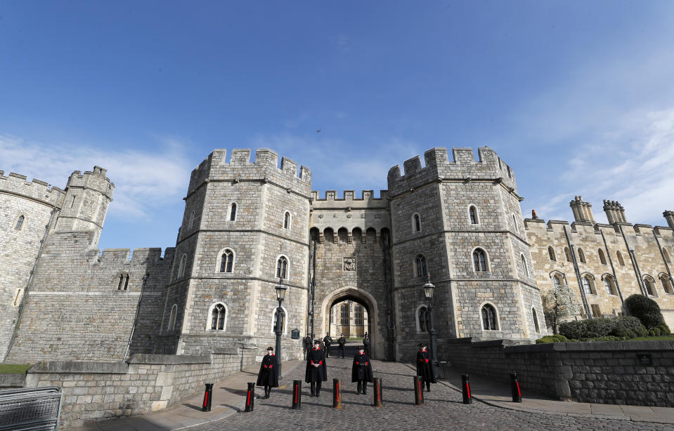 Guards stand at the entrance to Windsor Castle after the death of Britain's Prince Philip in Windsor, Sunday, April 11, 2021. Britain's Prince Philip, the irascible and tough-minded husband of Queen Elizabeth II who spent more than seven decades supporting his wife in a role that mostly defined his life, died on Friday. (AP Photo/Frank Augstein)