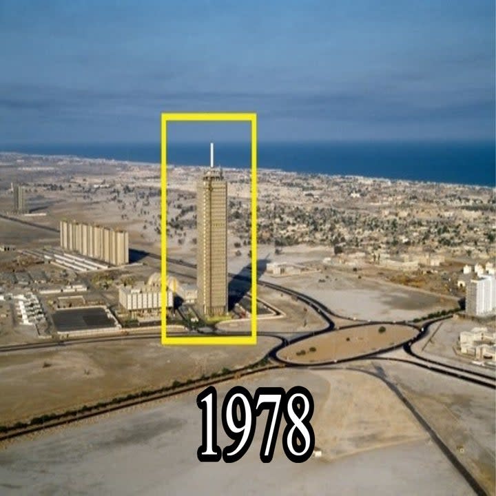 The Dubai World Trade Center in a desolate landscape, with only a few buildings nearby