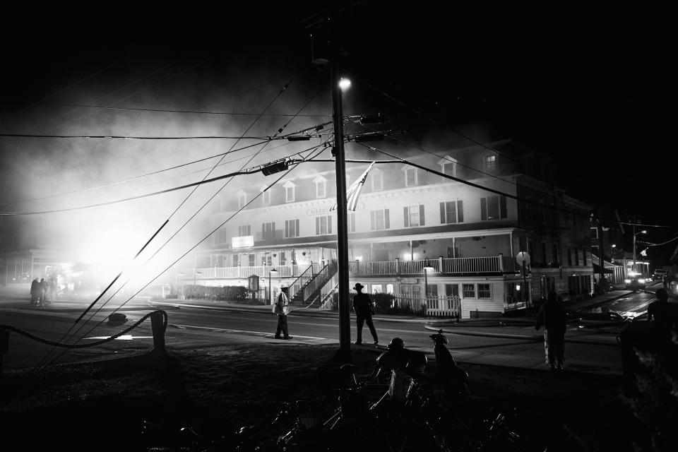 Smoke rises from the Harborside Inn in a photo taken from the street by guest Joe Pugliese after he was evacuated.