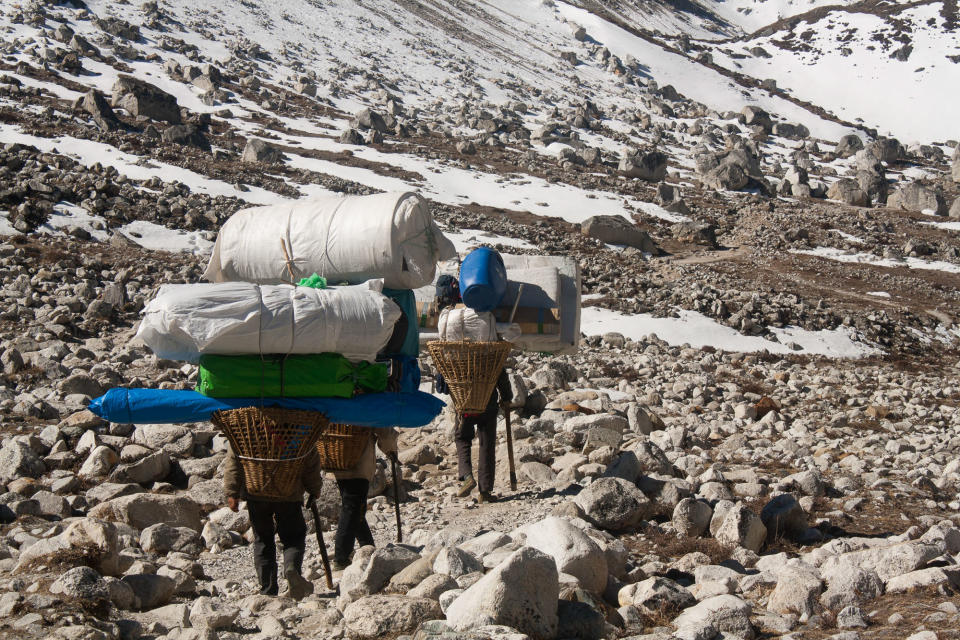 Sherpas carrying loads