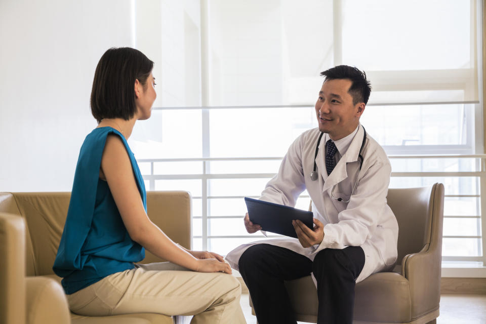 Doctor consulting with a patient in a bright office