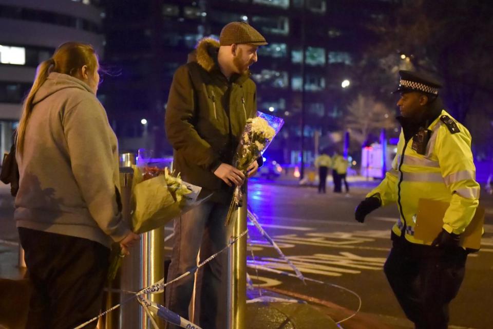 Floral tributes: People leave flowers on Westminster Bridge (REUTERS)