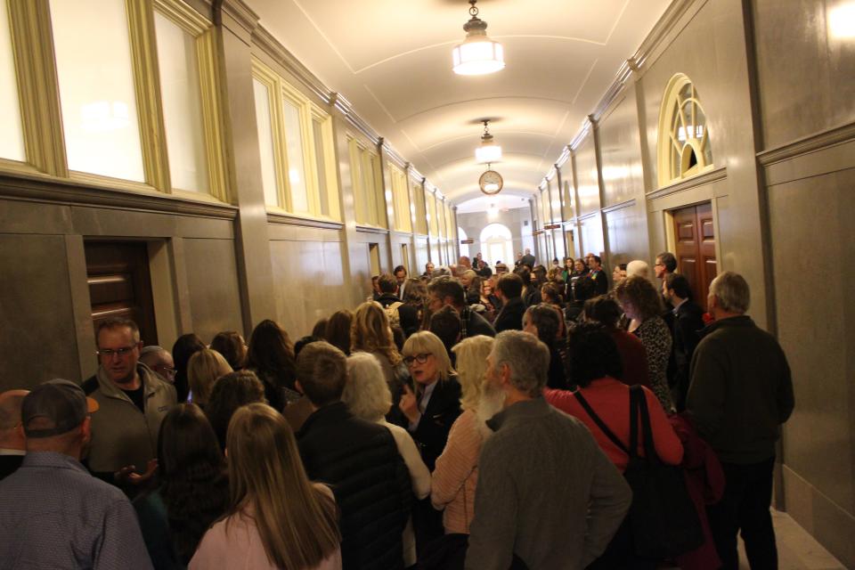 Members of the public wait outside a Senate committee hearing room in the Missouri State Capitol in Jefferson City on Jan. 31, 2023. Hearings on legislation regarding transgender youth has generated hours of public testimony.
