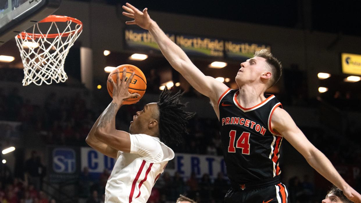 Rutgers' Jamichael Davis puts up a shot in front of Princeton's Matt Allocco during the men's college basketball game played at the Cure Insurance Arena in Trenton on Monday, November 6, 2023.