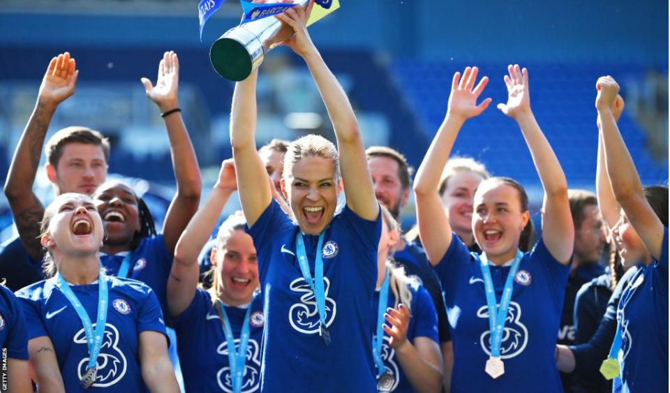 Melanie Leupolz lifts the Women's Super League trophy with her Chelsea team-mates