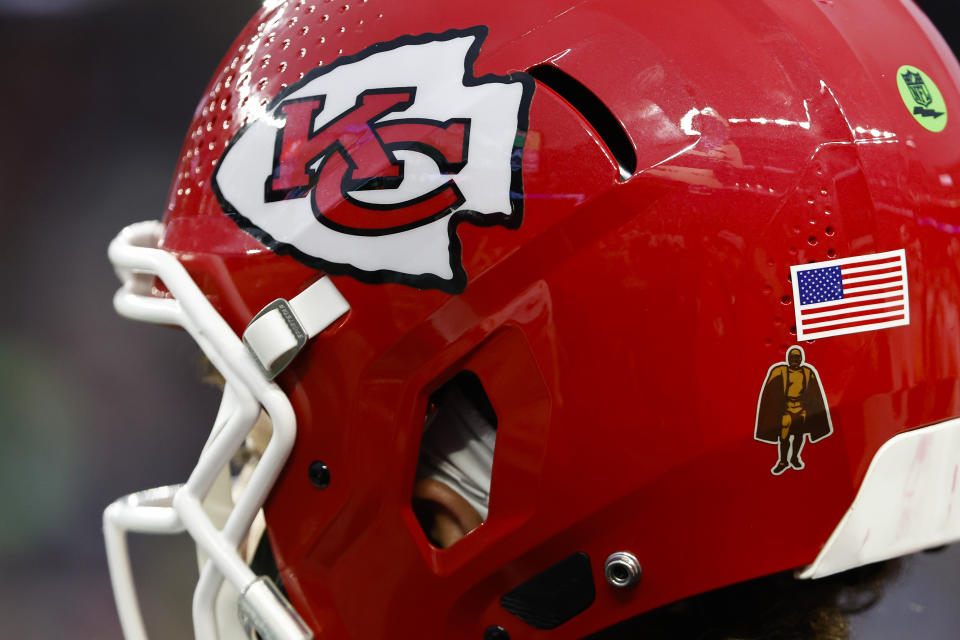 The Kansas City Chiefs logo, the Walter Payton NFL Man of the Year sticker and the American flag are seen on the helmet of Kansas City Chiefs quarterback Patrick Mahomes during an NFL football game at Gillette Stadium, Sunday, Dec. 17, 2023 in Foxborough, Mass. (Winslow Townson/AP Images for Panini)