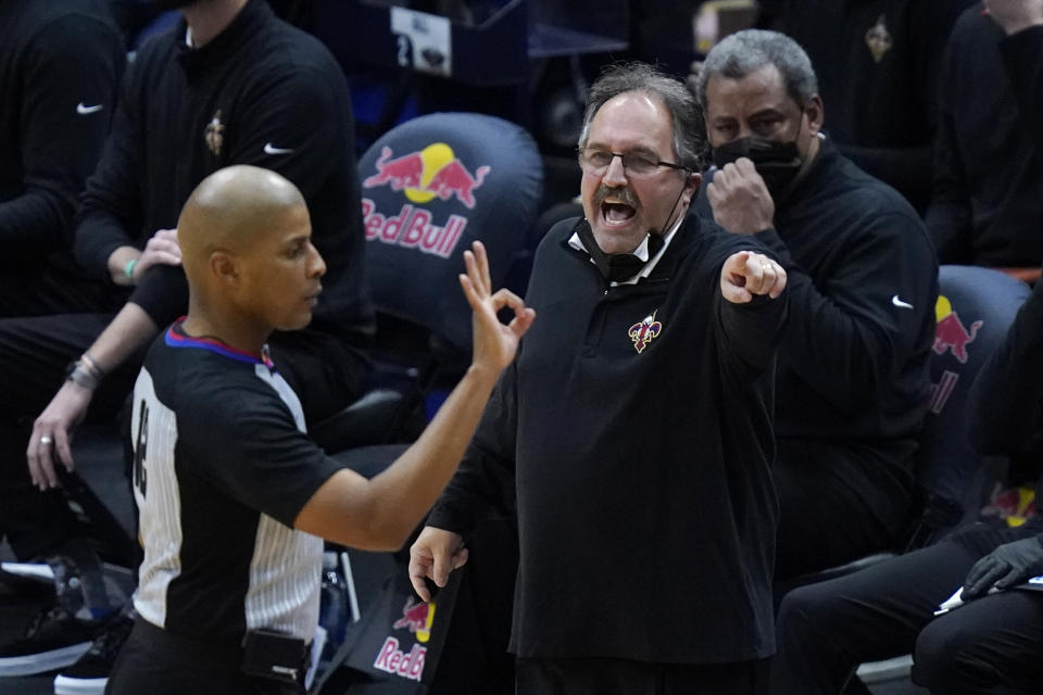 New Orleans Pelicans coach Stan Van Gundy questions referee CJ Washington during the first half of the team's NBA basketball game against the Chicago Bulls in New Orleans, Wednesday, March 3, 2021. (AP Photo/Gerald Herbert)