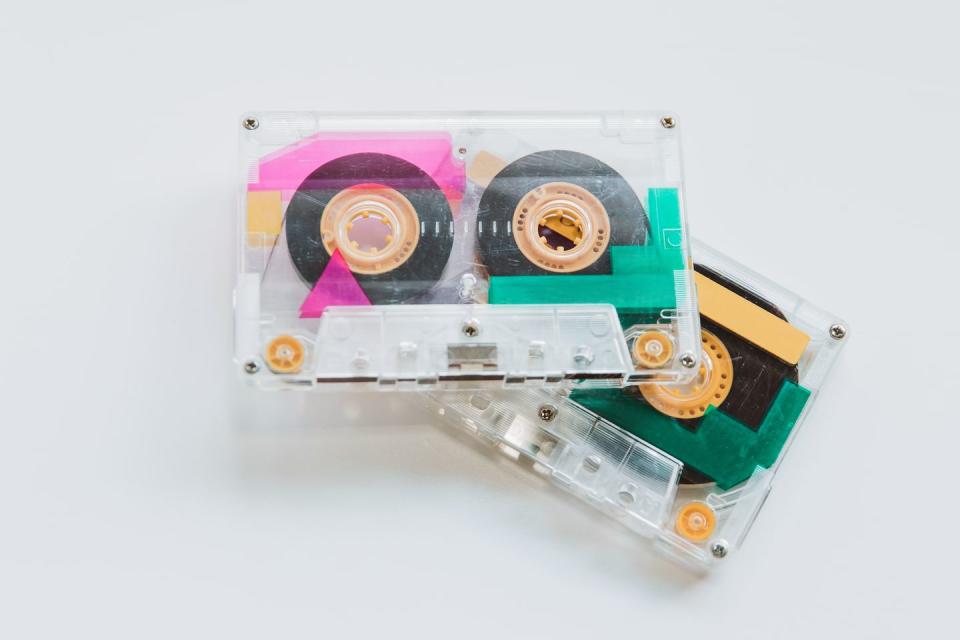 mixed tapes audio cassette tapes from the late 1980s or early 1990s conceptual image for vintage electronics, obsolete technology, and 80s nostalgia and 80s music themes vintage audio cassettes on white background, no people