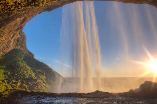 Sunset in Seljalandsfoss at south Iceland .