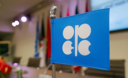 FILE PHOTO: A flag with the Organization of the Petroleum Exporting Countries (OPEC) logo is seen before a news conference at OPEC's headquarters in Vienna, Austria, December 10, 2016. REUTERS/Heinz-Peter Bader/File Photo