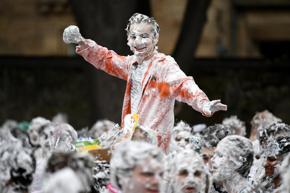 <p>Students from St Andrews University indulge in a tradition of covering themselves with foam to honor the “academic family” on Lower College Lawn on Oct. 23, 2017, in St Andrews, Scotland. (Photo: Jeff J Mitchell/Getty Images) </p>