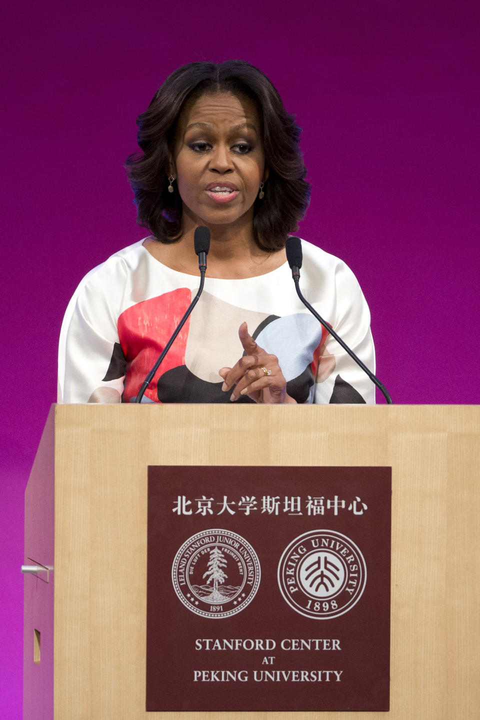 U.S. first lady Michelle Obama delivers a speech at Stanford Center in Peking University in Beijing, China, Saturday, March 22, 2014. (AP Photo/Alexander F. Yuan)