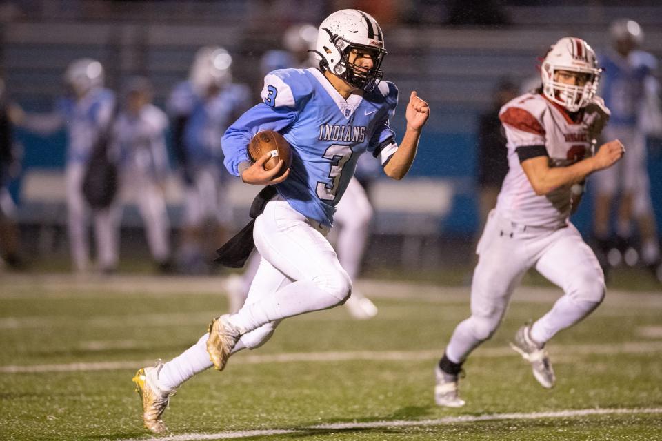 Saint Joseph's Alex Ortiz runs with the ball for a touchdown during the Kankakee Valley-Saint Joseph high school football game on Friday, October 29, 2021, at Father Bly Field in Leighton Stadium in South Bend, Indiana.