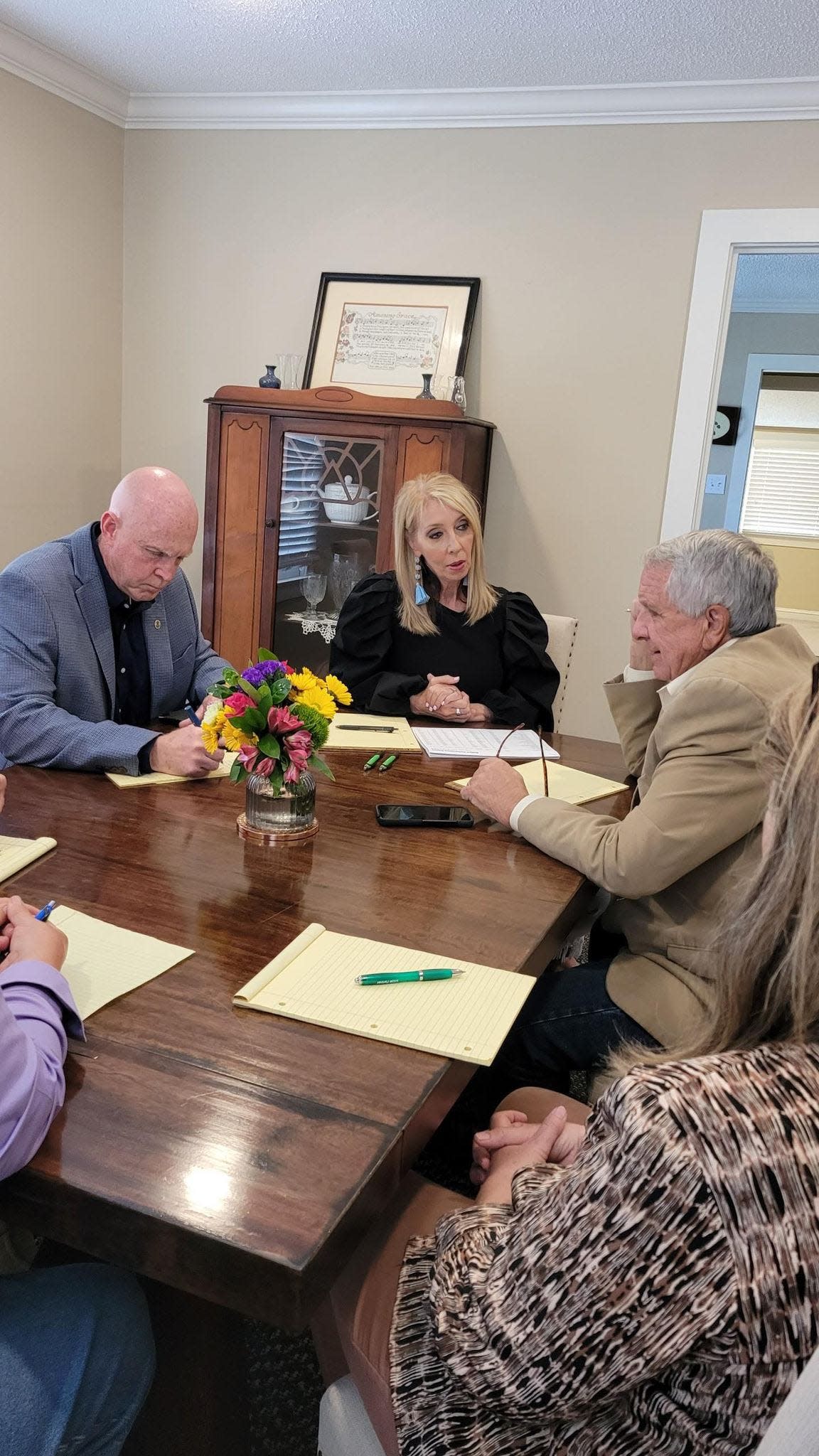 Lana Bellew, seated center, speaks with two Etowah County commissioners about receiving help with spaying and neutering of animals help during a recent meeting. Also present were Commissioners Tim Ramsey and Johnny Grant and fellow animal advocates Kate Pickette, Sandra Batson and Chris Moulds.