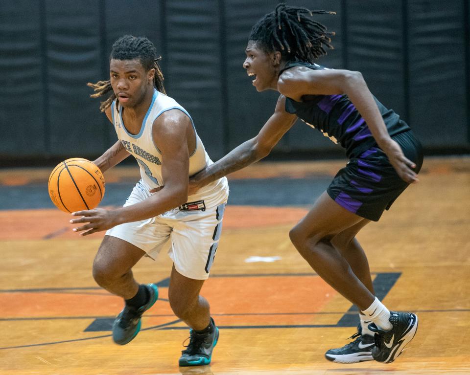 Lake Region's Brenton Allen dribbles up the court against Gainesville on Saturday in the Polk Hoops Shootout at Lakeland High School.