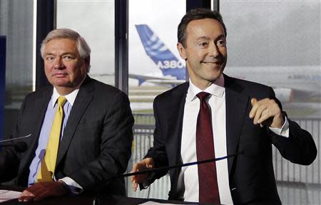 Fabrice Bregier (R), Airbus President and Chief Executive Officer, with John Leahy, Airbus Chief Operating Officer Customers, attend the Airbus annual press conference in Colomiers near, Toulouse, January 13, 2014. REUTERS/Regis Duvignau