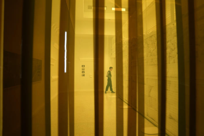 A man walks as he visits the "Everlasting Plastics" installation at the United States pavilion, at the Biennale International Architecture exhibition, in Venice, Italy, Wednesday, May 17, 2023. The 18th edition of the Biennale International Architecture exhibition will open to the public from Saturday May 20 to Sunday Nov. 26, 2023. (AP Photo/Antonio Calanni)