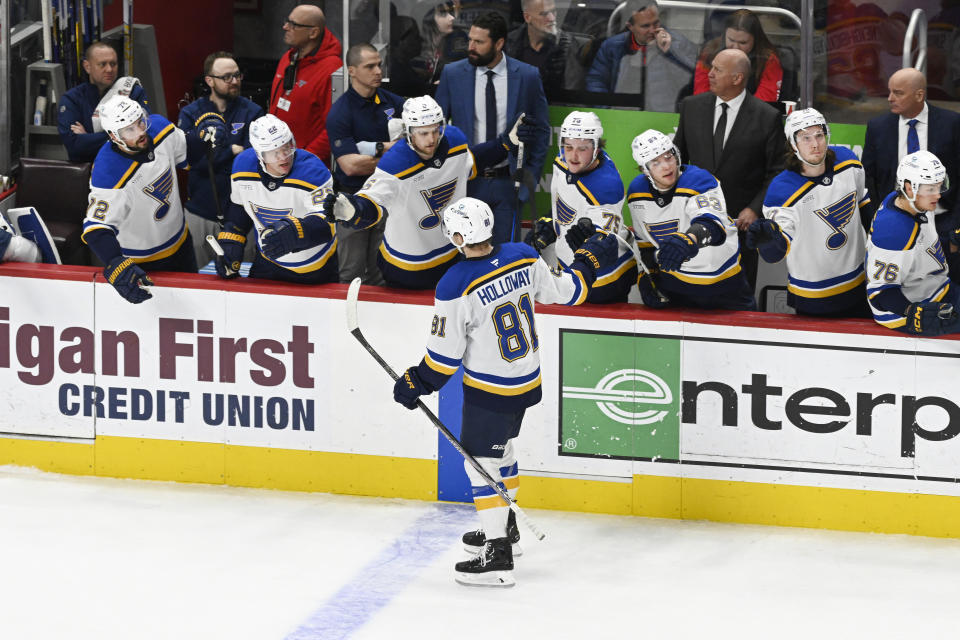 St. Louis Blues center Dylan Holloway (81) is congratulated after scoring a goal against the Detroit Red Wings during the first period of an NHL hockey game, Monday, Dec. 23, 2024, in Detroit. (AP Photo/Jose Juarez)