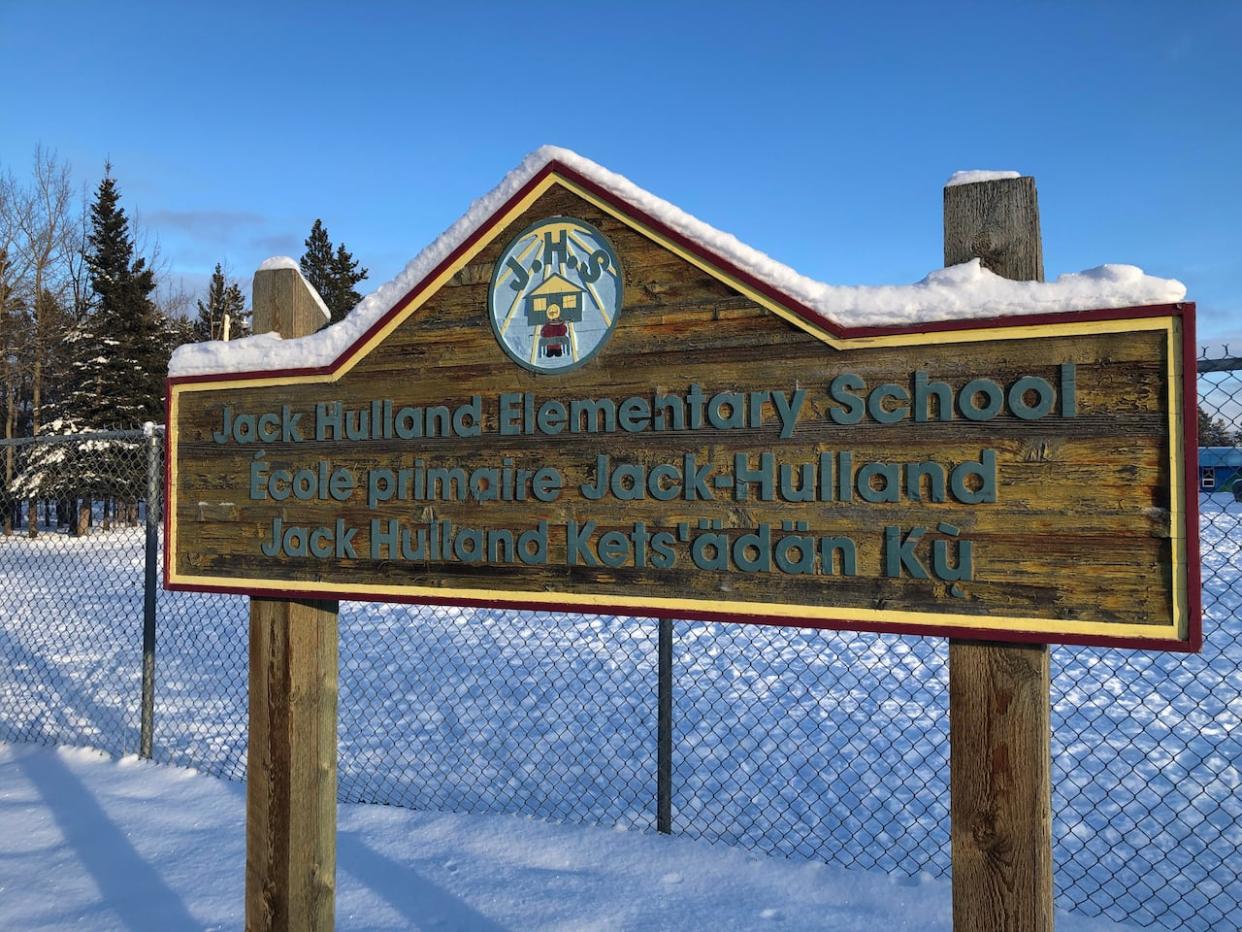 A sign at Jack Hulland Elementary School in Whitehorse. Last September, the Yukon Supreme Court gave the green light to a class-action lawsuit by students and parents at the school. (Jackie Hong/CBC - image credit)