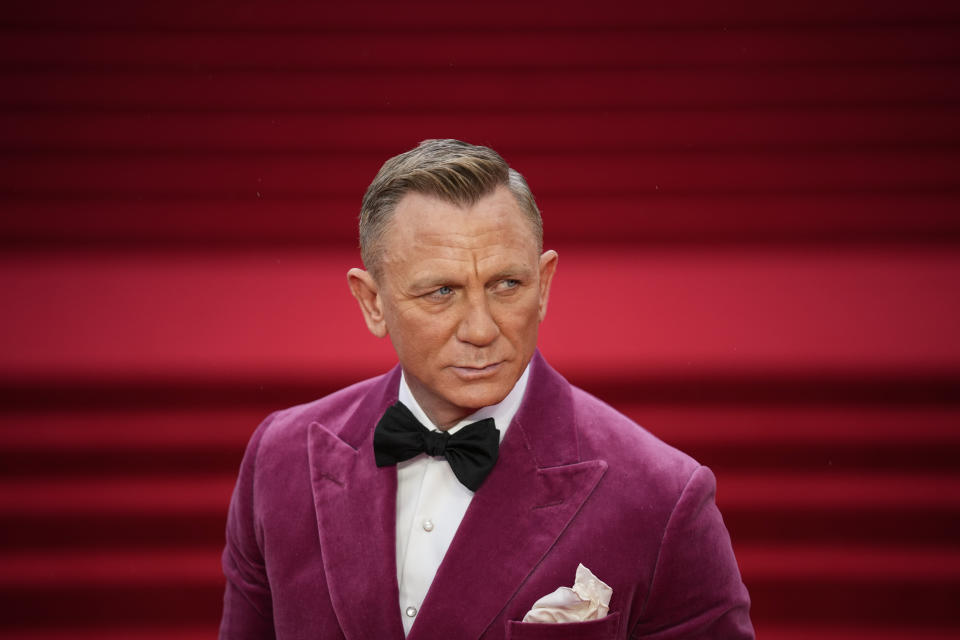 Daniel Craig poses for photographers upon arrival for the World premiere of the new film from the James Bond franchise 'No Time To Die', in London Tuesday, Sept. 28, 2021. (AP Photo/Matt Dunham)